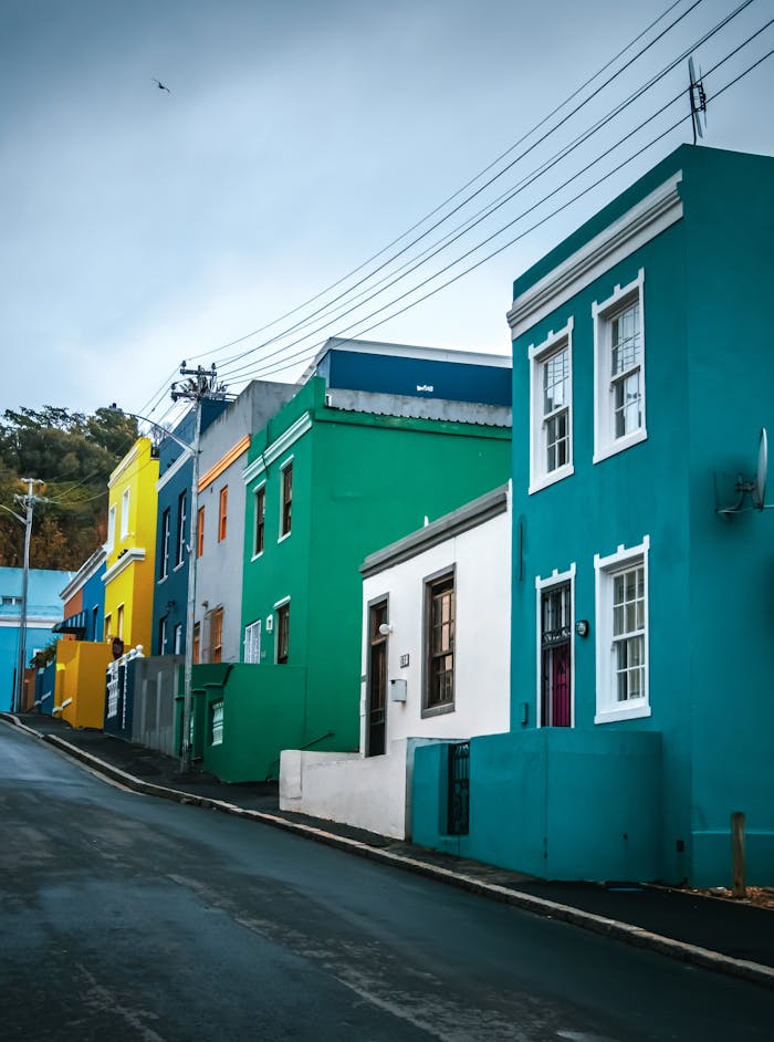 Colorful row of traditional Bo-Kaap houses in Cape Town on an overcast day.