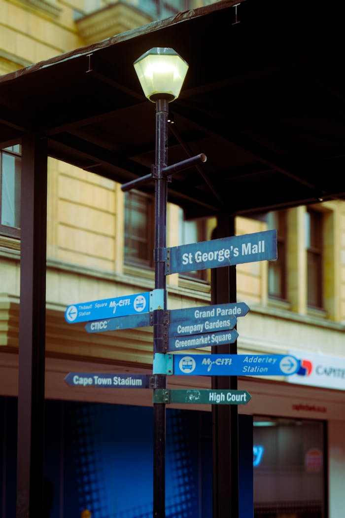 Street signpost in Cape Town showing directions to local landmarks, creating an urban vibe.